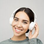 person listening on audio headphones